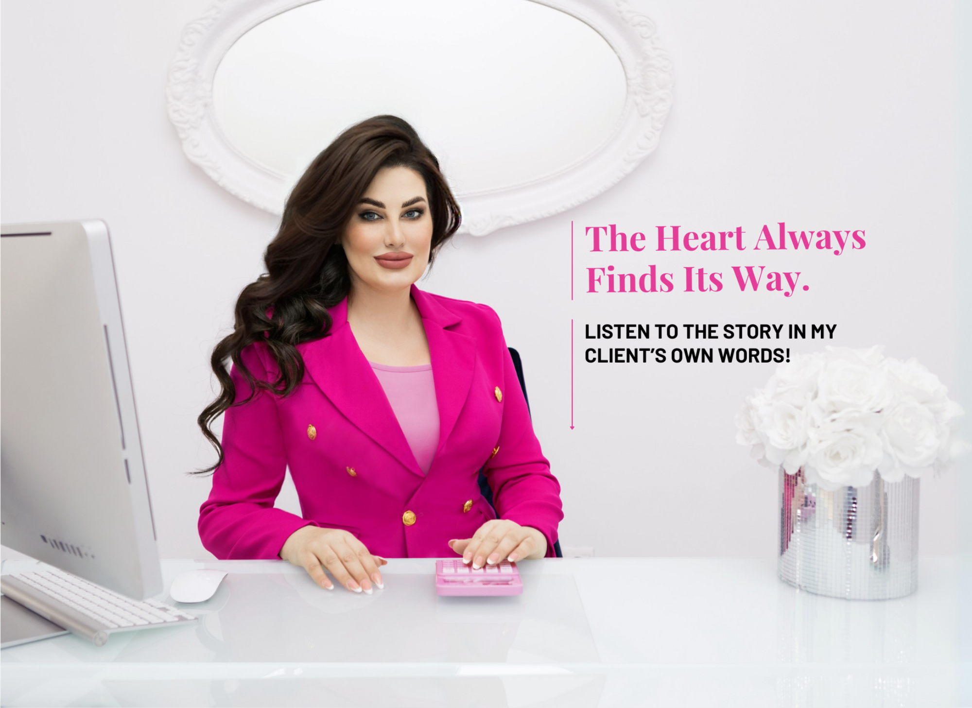 Aneta Mildiani, a relationship coach, is seated at her desk, dressed in a pink blazer. Next to her is a calculator and a vase of white roses. The image includes text promoting a client testimonial video, saying 'The Heart Always Finds Its Way' and 'Listen to the story in my client's own words!'