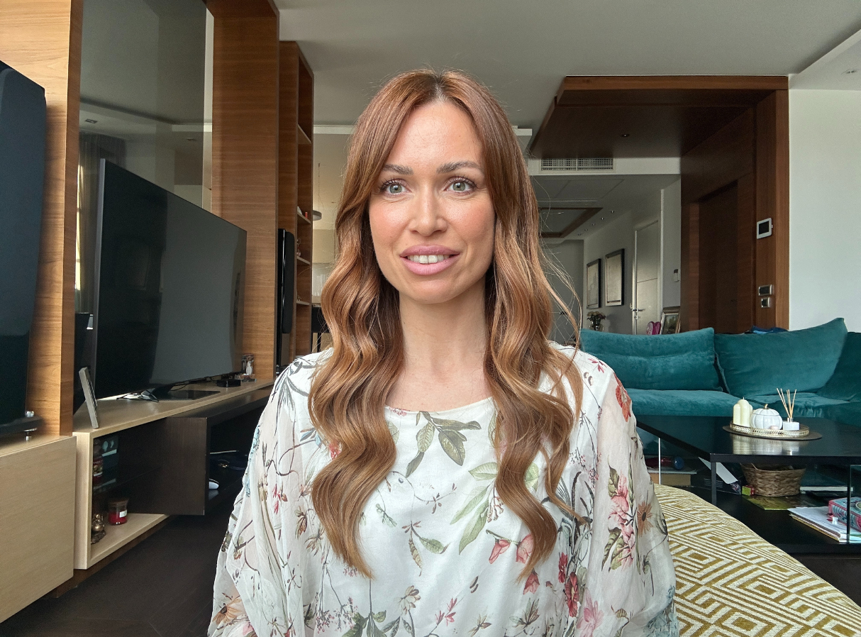 A testimonial photo showing a confident woman after transforming her dating life with a relationship coach.