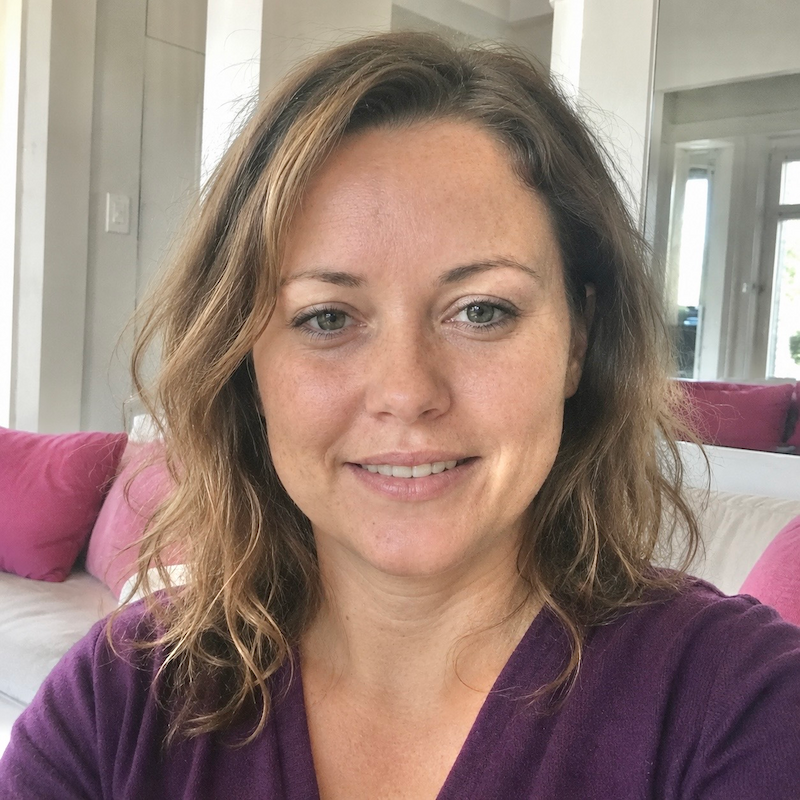 The confident smile of a client who successfully navigated a breakup. Her testimonial promotes Aneta Mildiani’s e-book as the essential resource for finding new love and healing.